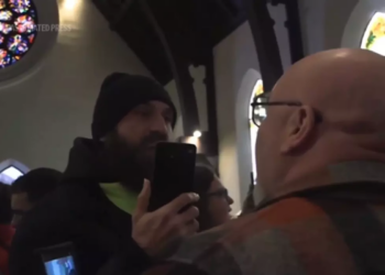 Justice Dept. investigating after activists disrupt Minnesota church where ICE official is a pastor