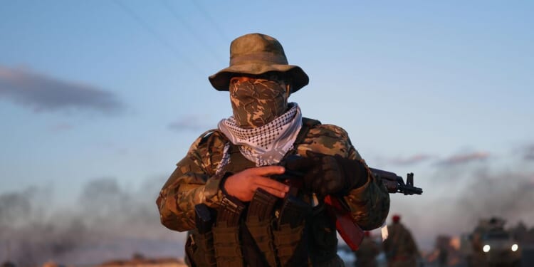 Government forces of Syria clash with Kurdish fighters as IS prisoners escape