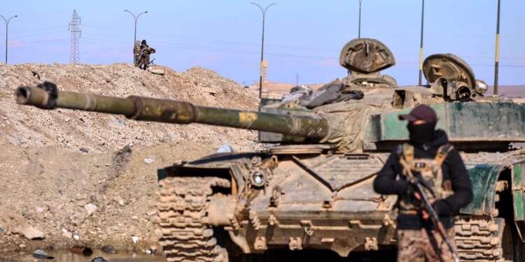 Syrian military says Kurdish guards abandoned IS-linked detainee camp