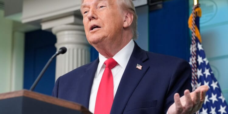 Trump boasts about his year-one record in surprise visit to White House briefing