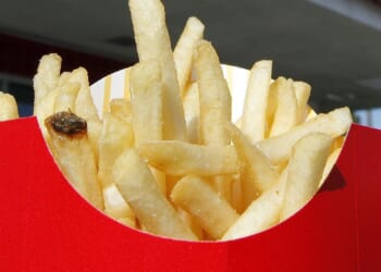 French fries, onions from loose shipping containers wash up on British beach