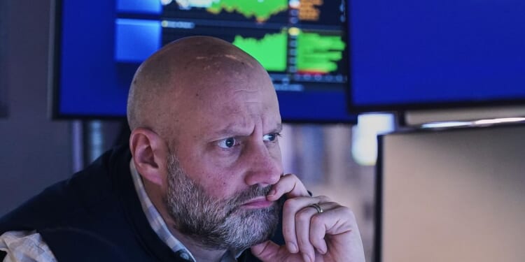 Stocks zigzag on Wall Street following mixed profit reports from GM, UnitedHealth and others