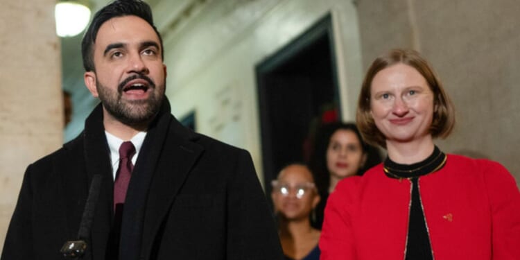 New York Mayor Zohran Mamdani, center, and Cea Weaver, right, the head of his new "Office to Protect Tenants," are seen at a New Year's Day news conference after Mamdani's swearing-in.