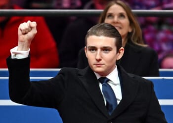 Barron Trump gestures after being acknowledged by his father, President Donald Trump, during the inaugural parade inside Capital One Arena, in Washington, D.C., on Jan. 20, 2025.