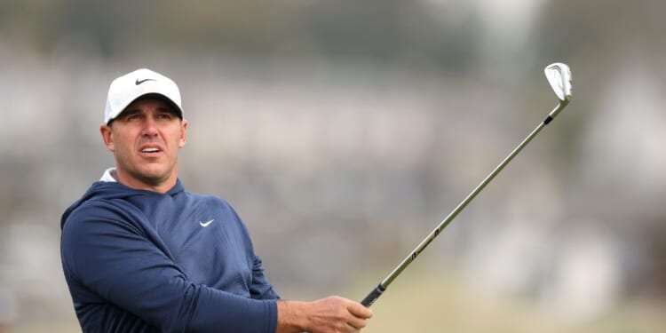 Brooks Koepka of the United States plays his second shot on the second hole on day one of the Alfred Dunhill Links Championship 2025 at Carnoustie Golf Links on Oct. 2, 2025, in Carnoustie, Scotland.