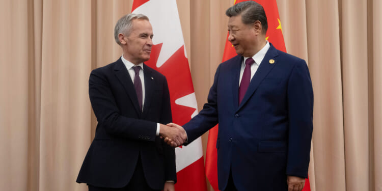 Canadian Prime Minister Mark Carney, left, greets Chinese President Xi Jinping in South Korea in a file photo from October.