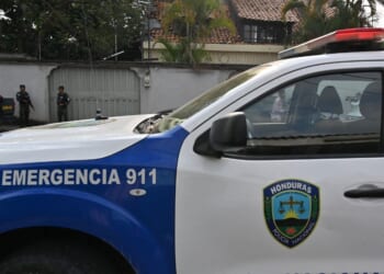 Military police and police pickup guard a street near Elliot Dover Christian School in Tegucigalpa on May 7, 2025.