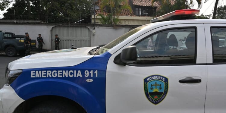 Military police and police pickup guard a street near Elliot Dover Christian School in Tegucigalpa on May 7, 2025.