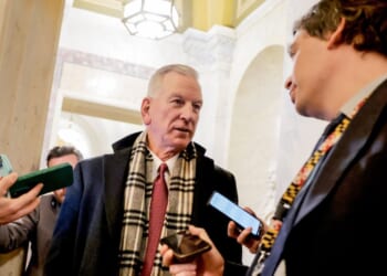 GOP Sen. Tommy Tuberville of Alabama, seen speaking to reporters Tuesday at the U.S. Capitol, was one of the Republicans who opposed advancing the funding package.
