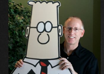 Scott Adams, creator of the comic strip"Dilbert," is seen in a file photo dated Oct. 26, 2006, posing for a portrait with the Dilbert character in his studio in Dublin, California. Adams has died of prostate cancer at age 68.