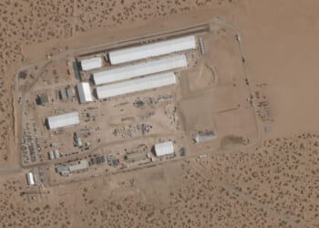 This Aug. 7, 2025, satellite image shows construction of large white tents for a new immigrant detention center at Fort Bliss, a U.S. Army base outside El Paso, Texas.