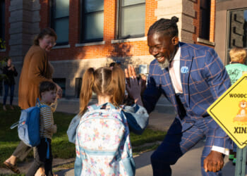 Ian Roberts, superintendent of Des Moines Public Schools, greets students at Greenwood Elementary School in Des Moines, Iowa, on Aug. 25, 2025.