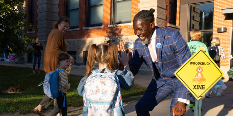 Ian Roberts, superintendent of Des Moines Public Schools, greets students at Greenwood Elementary School in Des Moines, Iowa, on Aug. 25, 2025.