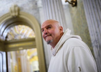 Sen. John Fetterman, one of eight Democrats to say he will vote with Republicans to open the government, arrives for votes on Nov. 10, 2025, on Capitol Hill in Washington, D.C.