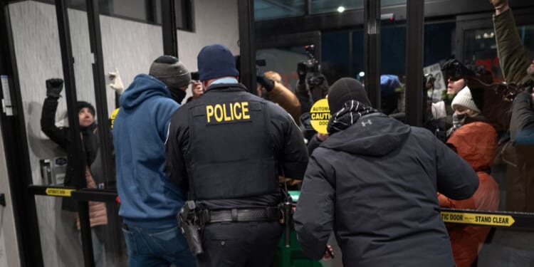 Rioters protest at a hotel on Jan. 25, 2026, in Minneapolis, Minnesota.