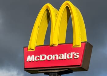 The sign for a McDonald's restaurant stands in front of a cloudy sky on Oct. 25, 2025.