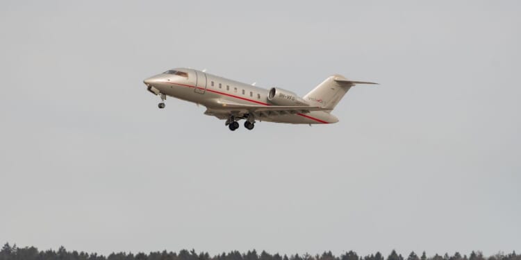 A Bombardier CL-600-2B16 Challenger is taking off from a runway on Feb. 24, 2022, in Zurich, Switzerland.