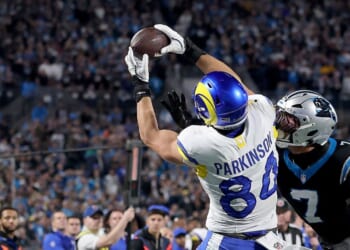 Los Angeles Rams tight end Colby Parkinson makes a 19-yard pass against Carolina Panthers safety Tre'von Moehrig in the fourth quarter during the NFC wild card game between the Carolina Panthers and Los Angeles Rams at the Bank of America Stadium in Charlotte, North Carolina, on Saturday, Jan. 10, 2026.