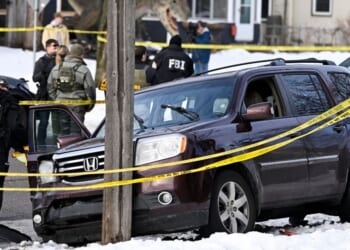 Members of law enforcement work the scene following a suspected shooting by an ICE agent during federal law enforcement operations on Jan. 7, 2026, in Minneapolis, Minnesota.