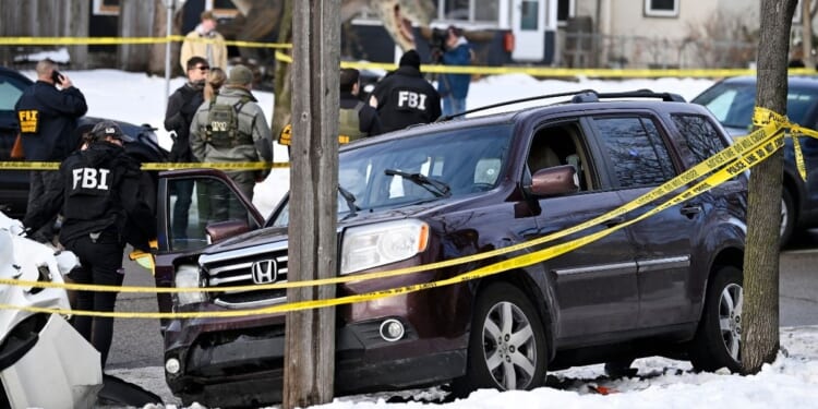 Members of law enforcement work the scene following a suspected shooting by an ICE agent during federal law enforcement operations on Jan. 7, 2026, in Minneapolis, Minnesota.