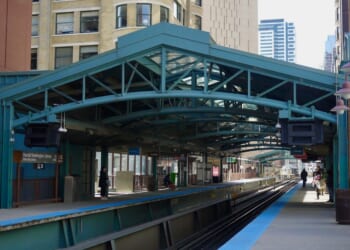 A view of the elevated train platform for the State and Van Buren station stop next to the Harold Washington Library in downtown Chicago, Illinois, in 2019.