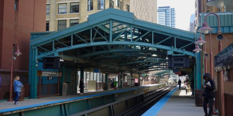 A view of the elevated train platform for the State and Van Buren station stop next to the Harold Washington Library in downtown Chicago, Illinois, in 2019.