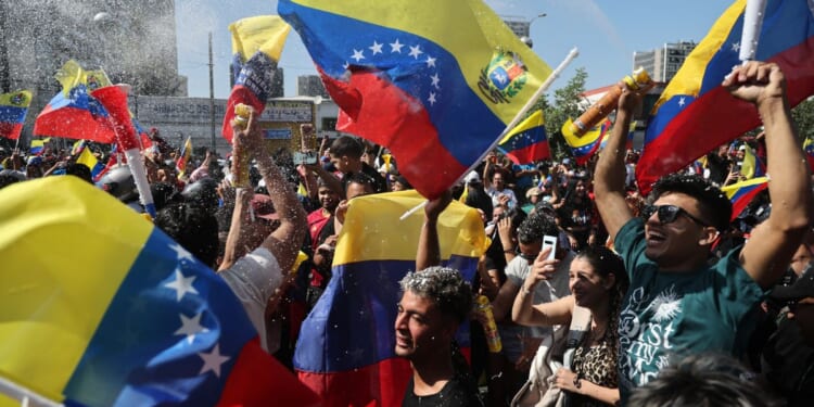 Venezuelans living in Chile celebrate in Santiago on Jan. 3, 2026, after U.S. forces captured Venezuelan leader Nicolas Maduro after launching a "large scale strike" on Venezuela.