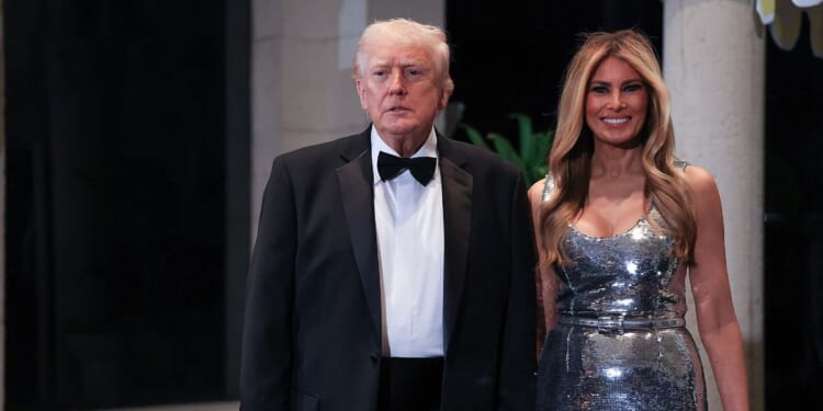 President Donald Trump and First Lady Melania Trump arrive for a New Year’s Eve event at his Mar-a-Lago home on Dec. 31, 2025, in Palm Beach, Florida.