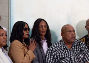 Family and friends of Keith Porter Jr. pose for a photo after a news conference on Jan. 5, 2026, in Studio City, California.