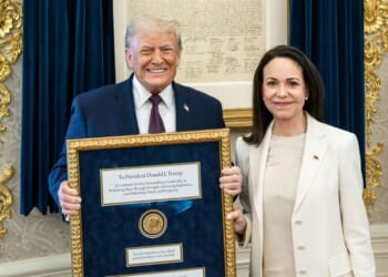 President Donald Trump accepts a Nobel Peace Prize originally awarded to Venezuelan opposition leader Maria Corina Machado who chose to gift it to him in the Oval Office of the White House on Jan. 15, 2026 in Washington, DC.