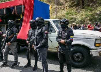 Members of a pro-government group known as the "Colectivos" stand guard during military exercises announced by President Nicolas Maduro in Caracas on Jan. 23, 2025.