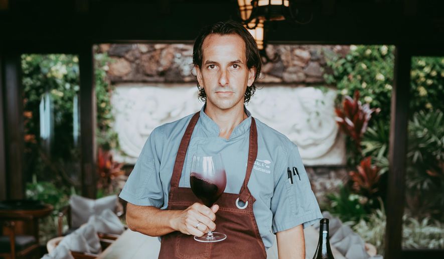 CORRECTS NAMES TO MASTRASCUSA - This photo provided by Natalia Mastrascusa shows Nick Mastrascusa posing for a photo in Kailua-Kona, Hawaii, 2023. (Natalia Mastrascusa via AP)