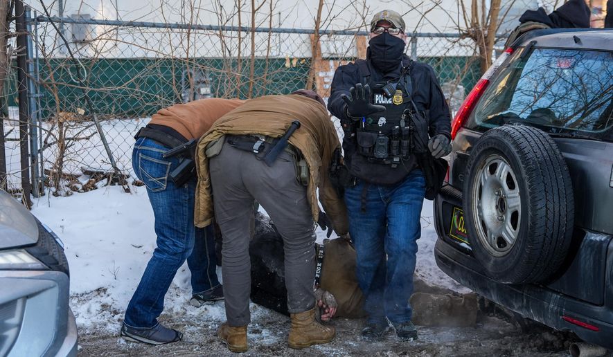 An activist is detained by federal agents on Tuesday, Feb. 3, 2026, in Minneapolis. (AP Photo/Ryan Murphy)