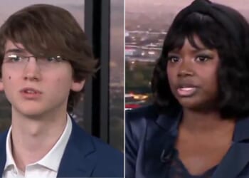 Republican voter Ajua Mason, right, told Brett Trussell, left, that it is "completely outrageous" to suggest minorities are not educated enough to obtain voter ID documents.