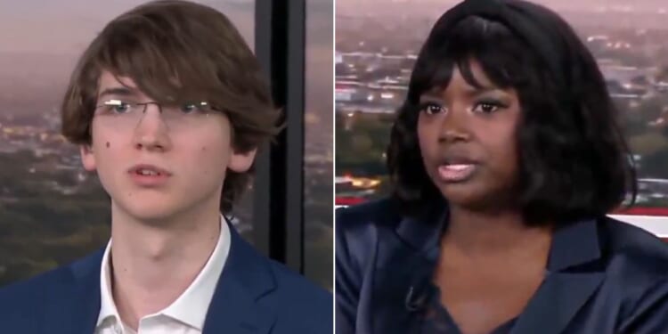 Republican voter Ajua Mason, right, told Brett Trussell, left, that it is "completely outrageous" to suggest minorities are not educated enough to obtain voter ID documents.