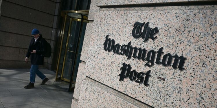 A man exits the Washington Post office building in Washington, D.C., in a file photo dated Feb. 4.