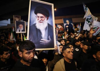 Iraqi Shiites carry a portrait of Iran's Supreme Leader Ayatollah Ali Khamenei during a protest Saturday against U.S. and Israeli attacks on Iran. News sources were reporting that Khameni has be