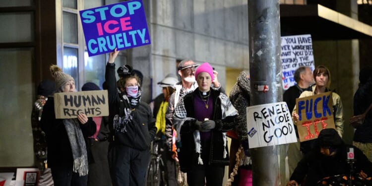 Anti-ICE activists display signs during a protest at the U.S. Immigration and Customs Enforcement facility on Jan. 9, 2026, in Portland, Oregon.
