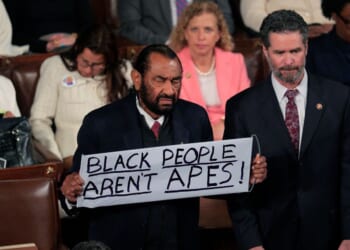 Rep. Al Green, a Democrat from Texas, holds up a sign as Trump delivers his State of the Union address during a joint session of Congress at the U.S. Capitol on Feb. 24, 2026, in Washington, D.C.