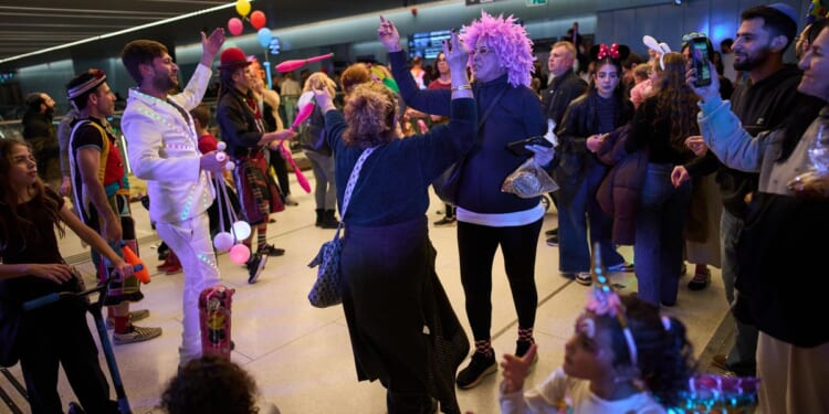 Israelis celebrate Purim with parties in bomb shelters amid Iran war threat