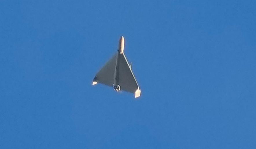 An Iranian Shahed exploding drone launched by Russia flies through the sky seconds before it struck buildings in Kyiv, Ukraine, on Oct. 17, 2022. (AP Photo/Efrem Lukatsky, File)