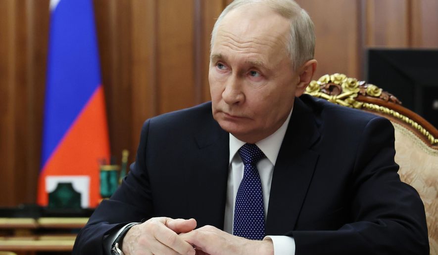 FILE - Russian President Vladimir Putin listens to Roman Artyukhin, the head of the treasury, at the Kremlin in Moscow, on Tuesday, March 3, 2026. (Gavriil Grigorov/Sputnik, Kremlin Pool Photo via AP, File)