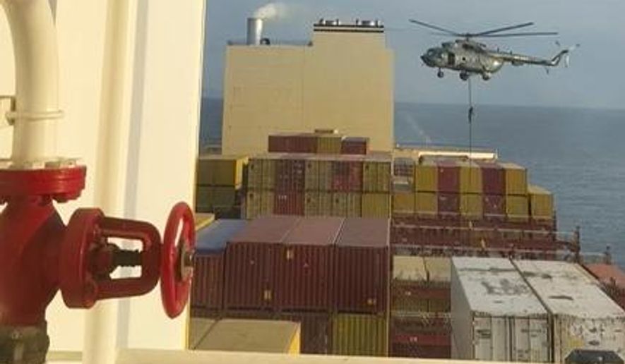 FILE - This image made from a video provided to The Associated Press by a Middle East defense official shows a helicopter raid targeting a vessel near the Strait of Hormuz on Saturday, April 13, 2024. (AP Photo, File)