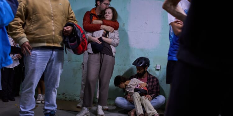 Iran’s president apologizes for strikes on neighbors as missiles and drones still pound their cities