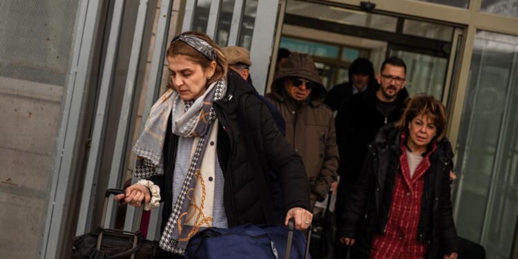 Iran’s border with Turkey offers a way out, but few are leaving for good