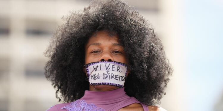 Women’s Day marches in Brazil decry gender-based violence, fueled by alleged gang rape in Copacabana
