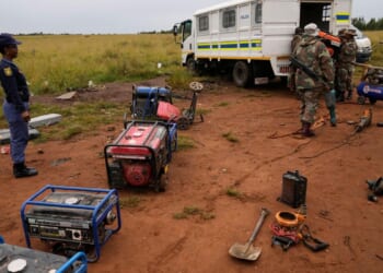 South African soldiers dismantle illegal mining operations near Johannesburg as miners flee