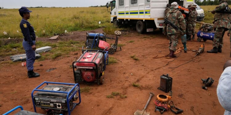 South African soldiers dismantle illegal mining operations near Johannesburg as miners flee