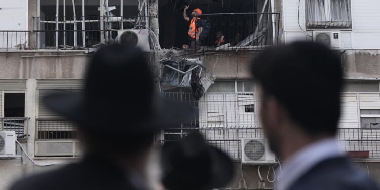 Gulf Arab states intercept new missiles and drones as Iran threatens to widen the war