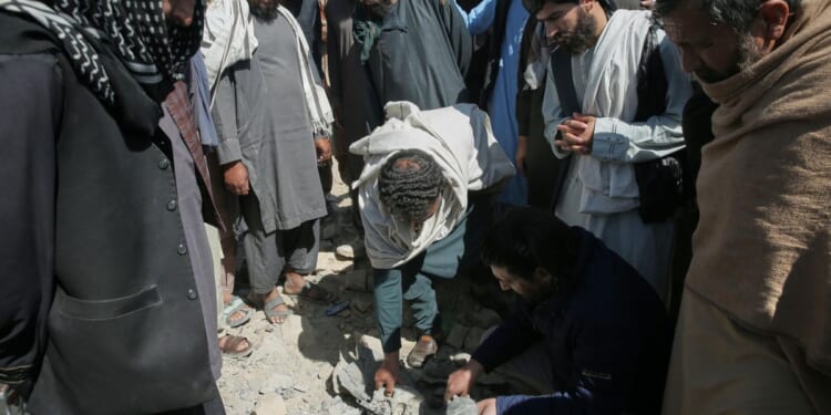 Afghanistan says Pakistani mortars killed 2 children as fighting stretches into third week